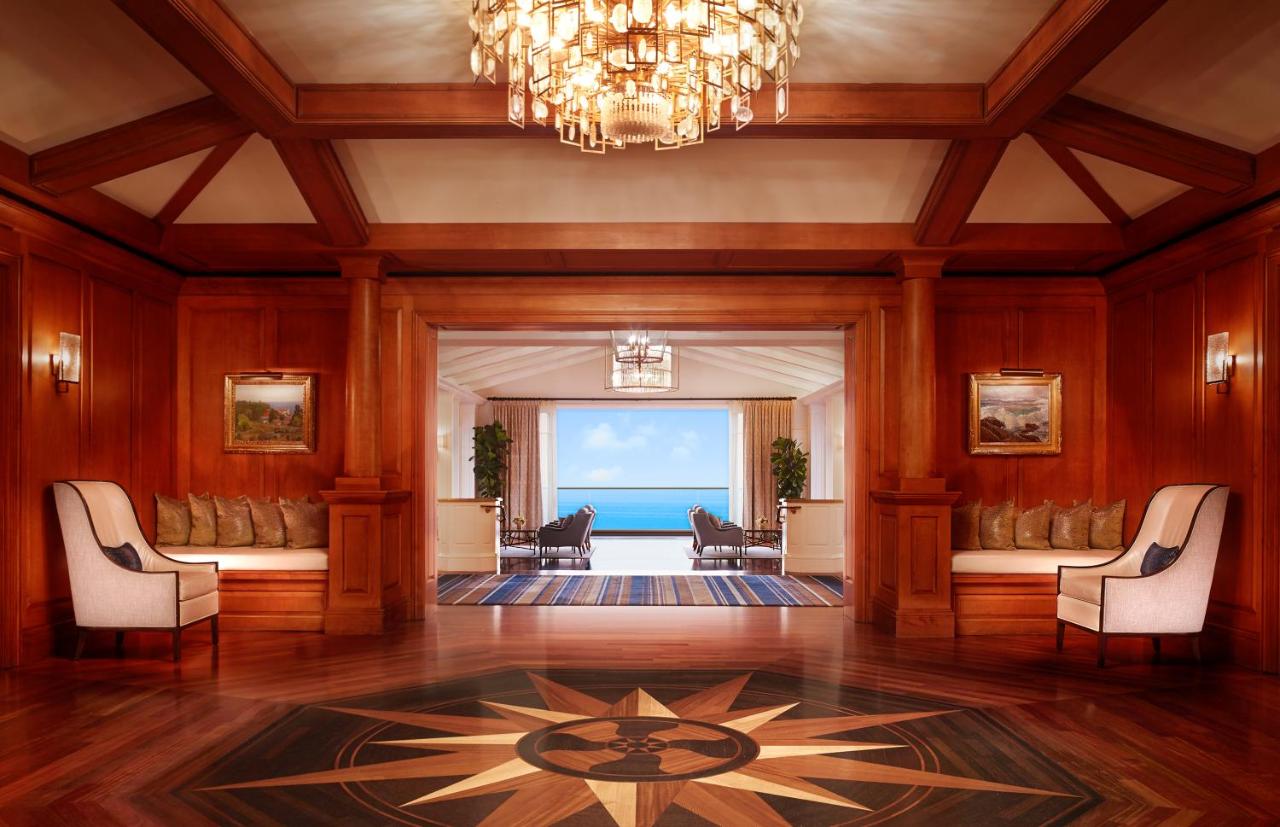 A wood panel room for spa waiting room with direct view to the ocean