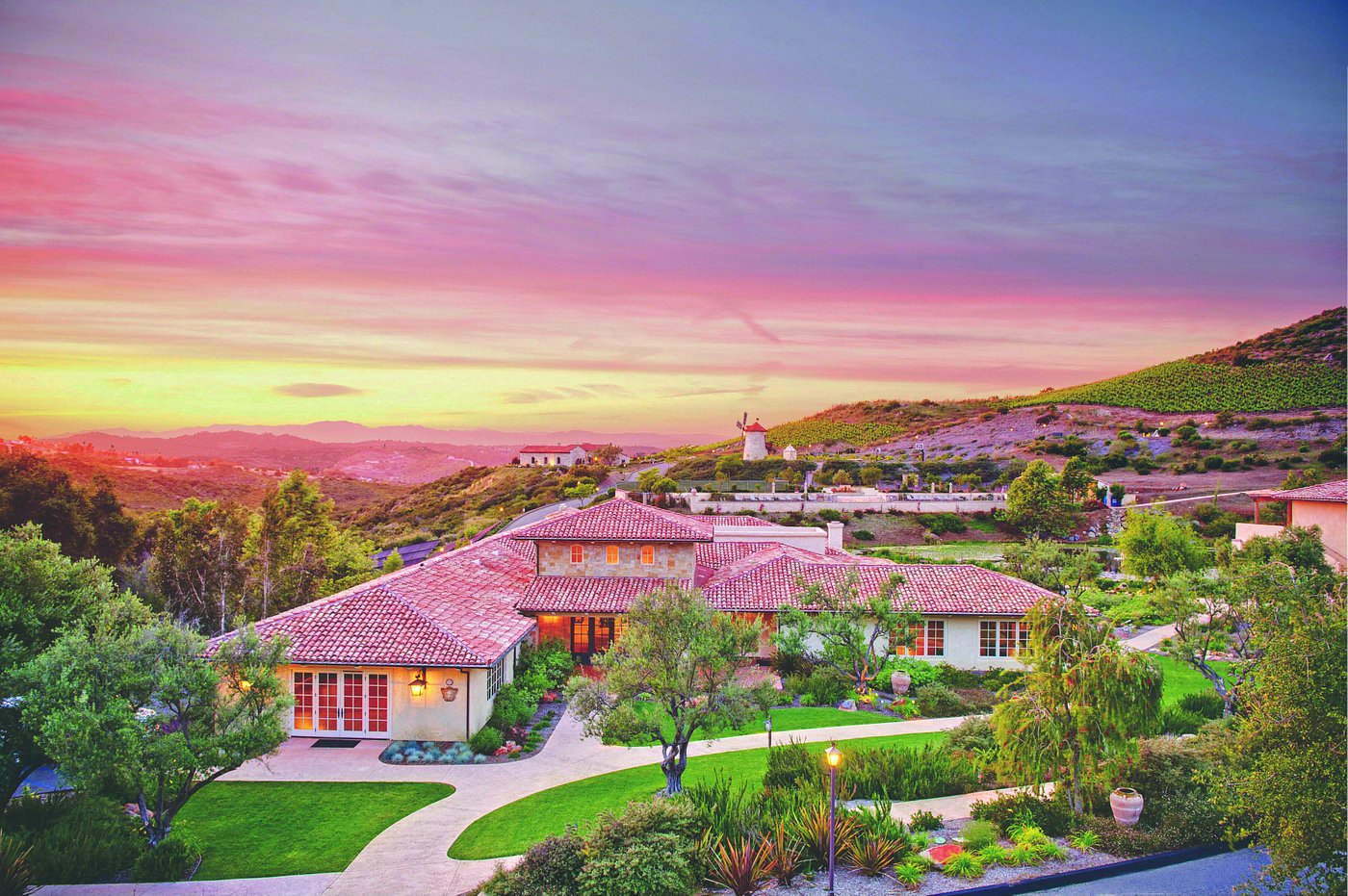 The sunrise over the one of the best wellness resorts in the US, Cal-a-vie with mountains, pool, and gorgeous hillside resort perfect for relaxation of California spa resorts in USA