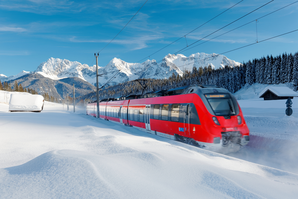 Enjoy the winter snow traveling through Germany by red train