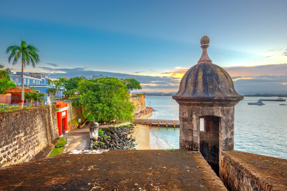 San Juan, Puerto Rico Caribbean coast along Paseo de la Princesa at dusk.